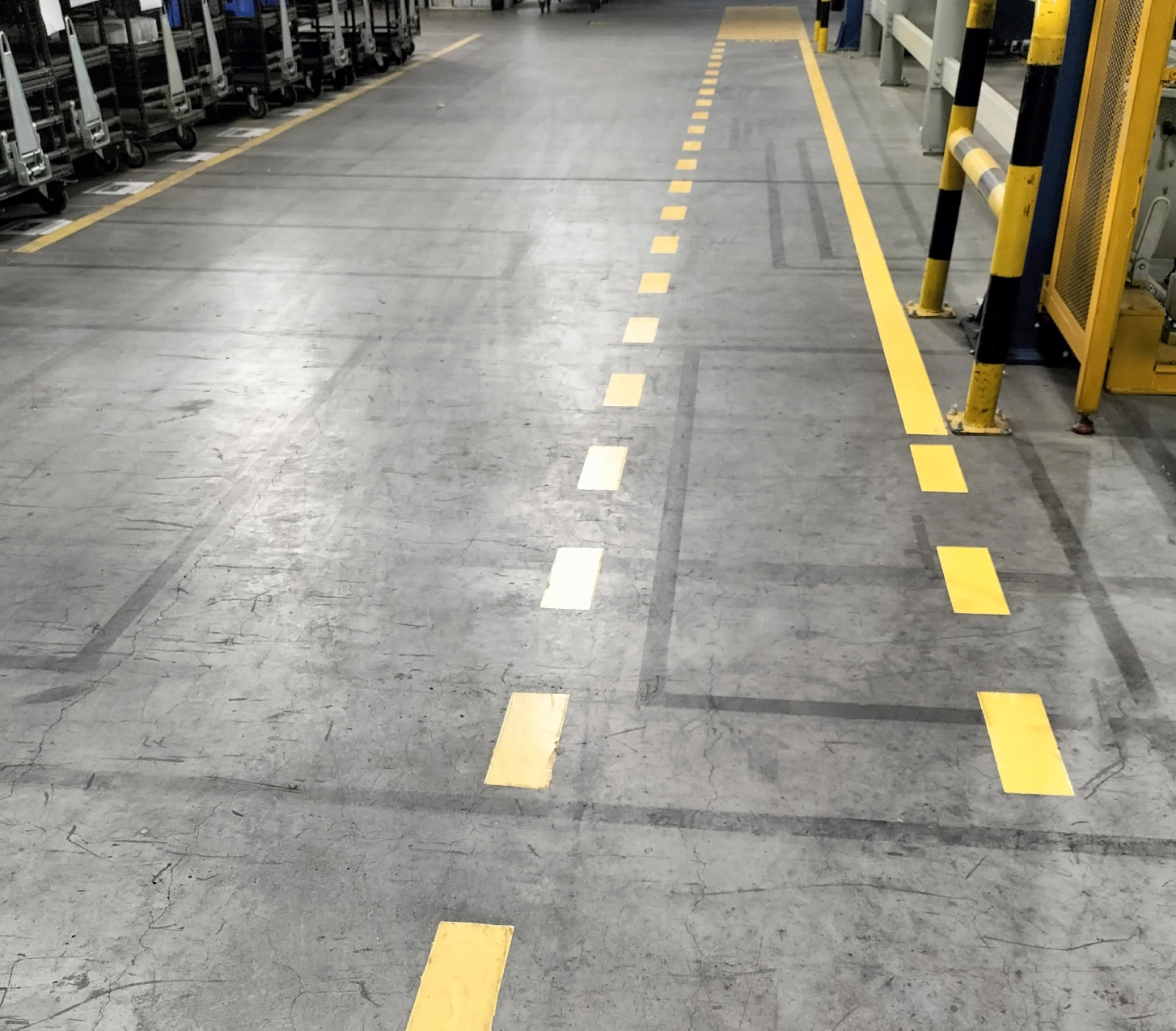 Factory floor with yellow lane markings.