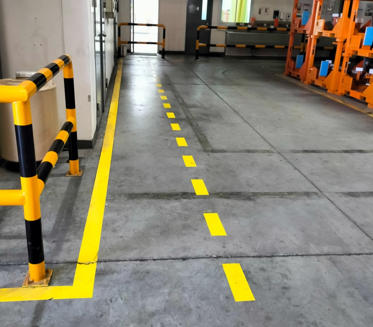 Factory floor with yellow safety lines.