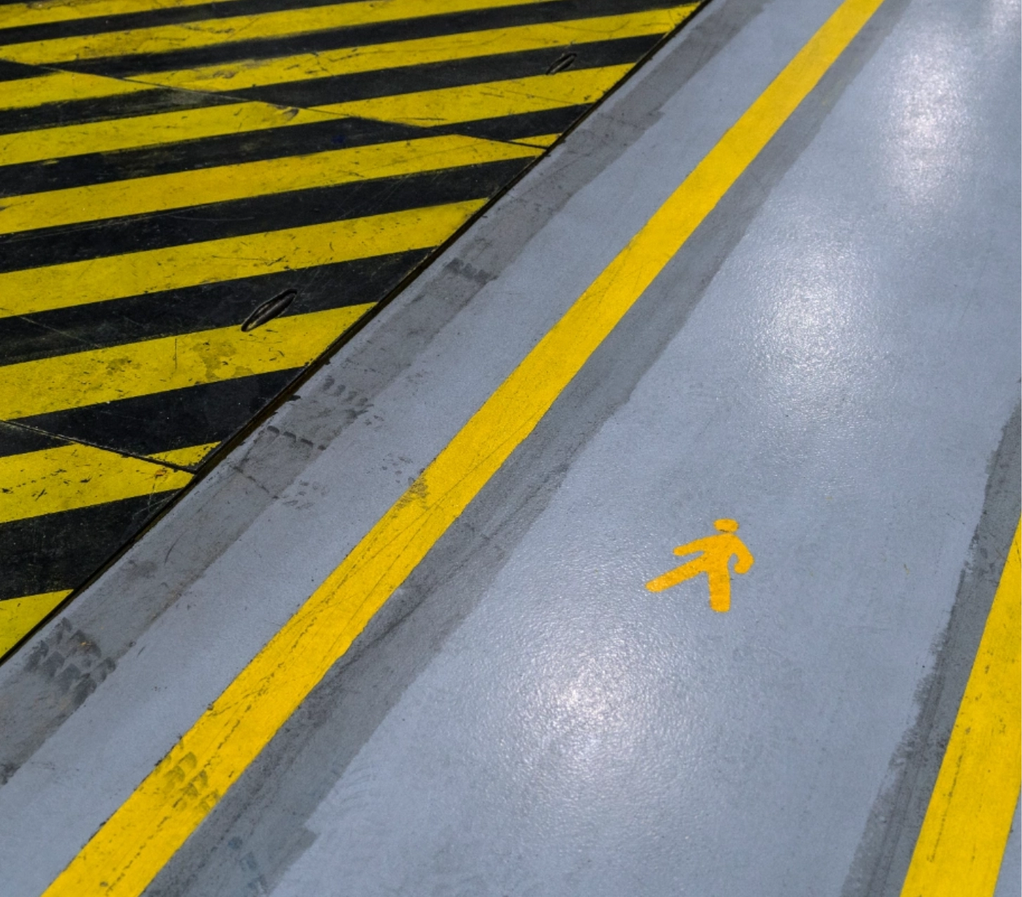 Pedestrian walkway with yellow lines.