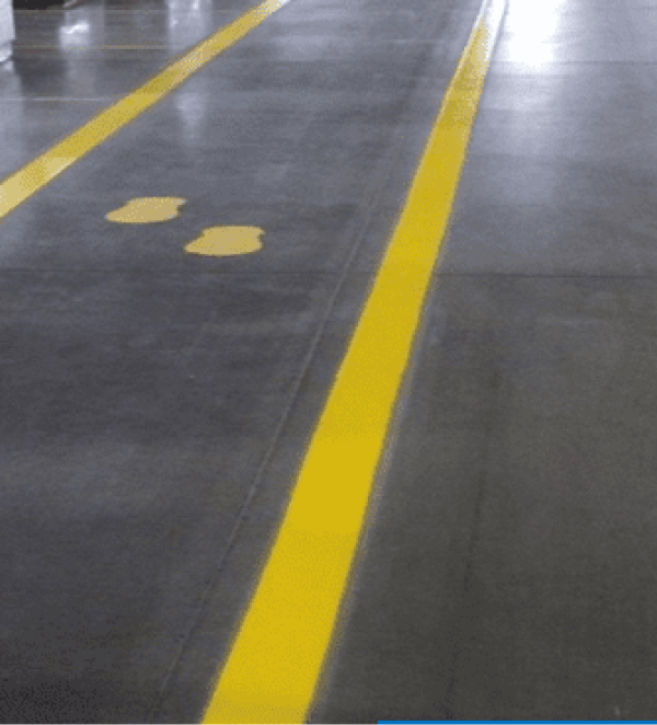 Floor markings, yellow lines, grey floor.