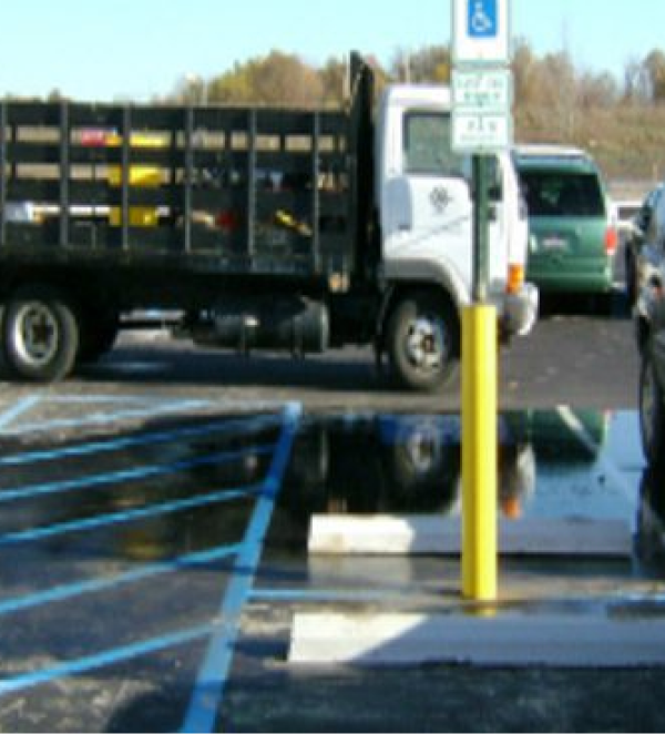 Truck parked in handicapped parking spot.