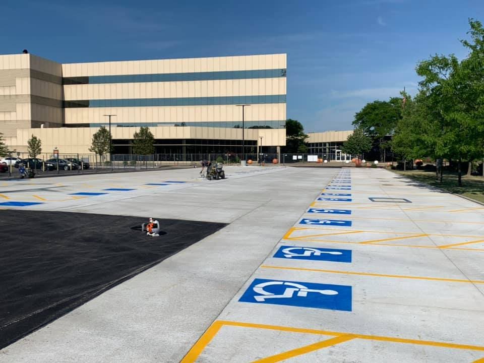 A parking lot with blue and yellow lines on it.