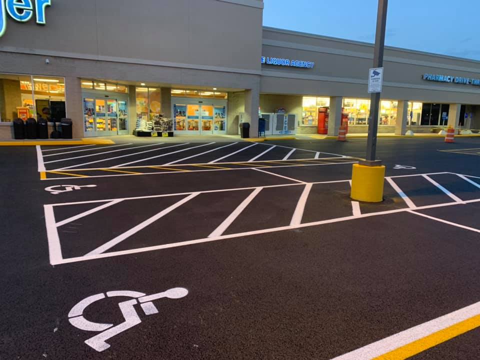 A parking lot with handicapped signs painted on it.